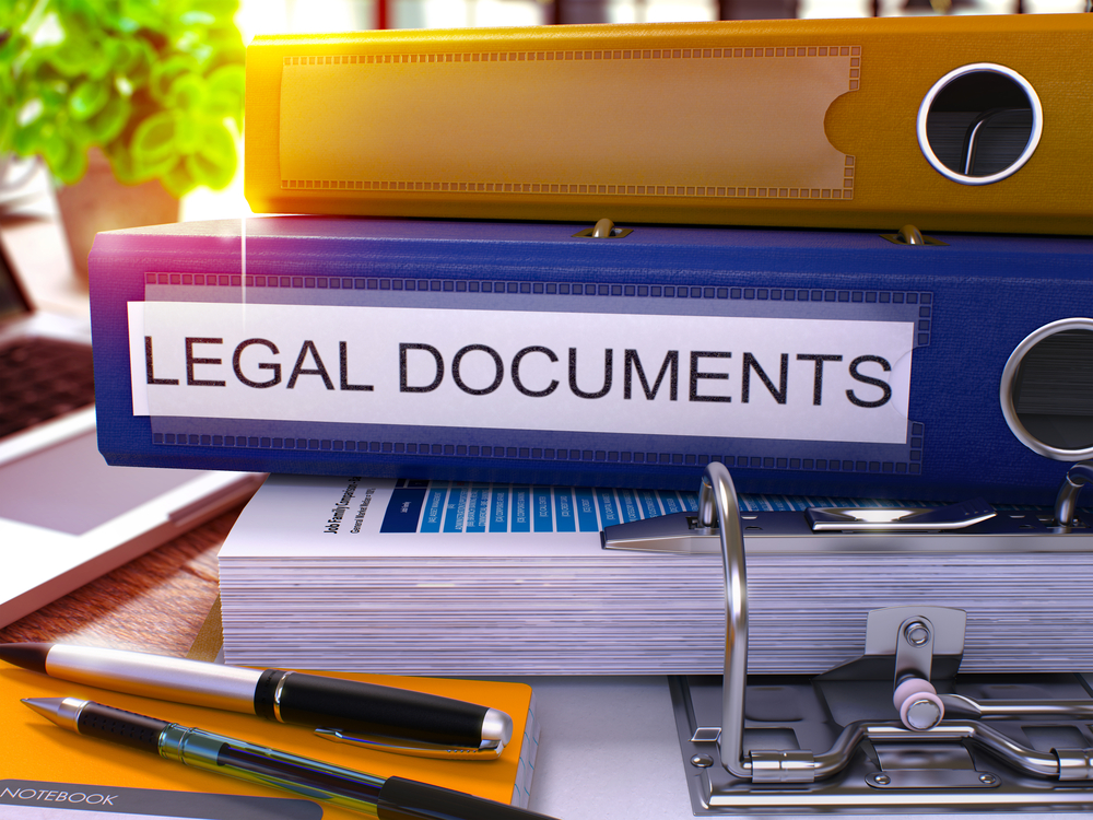Blue Office Folder with Inscription Legal Documents on Office Desktop with Office Supplies and Modern Laptop. Legal Documents Business Concept on Blurred Background. Legal Documents - Toned Image. 3D. Blue Office Folder with Inscription Legal Documents on Office Desktop with Office Supplies and Modern Laptop. Legal Documents Business Concept on Blurred Background. Legal Documents - Toned Image. 3D.